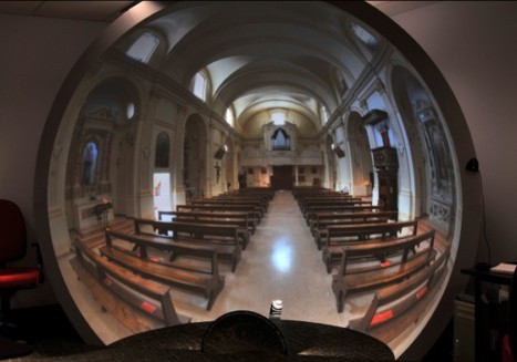 The curvature in this image is because the camera is located back from the center of the dome. To the seated viewer all the lines look straight.