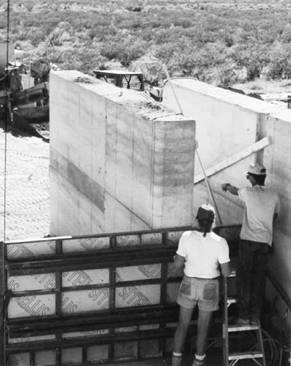 Rammed earth wall after removal of forms.