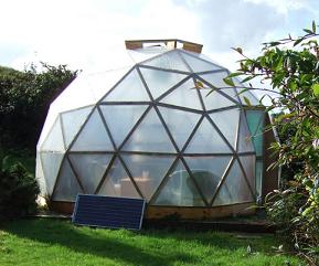 A timber geodesic dome covered with polyethylene film